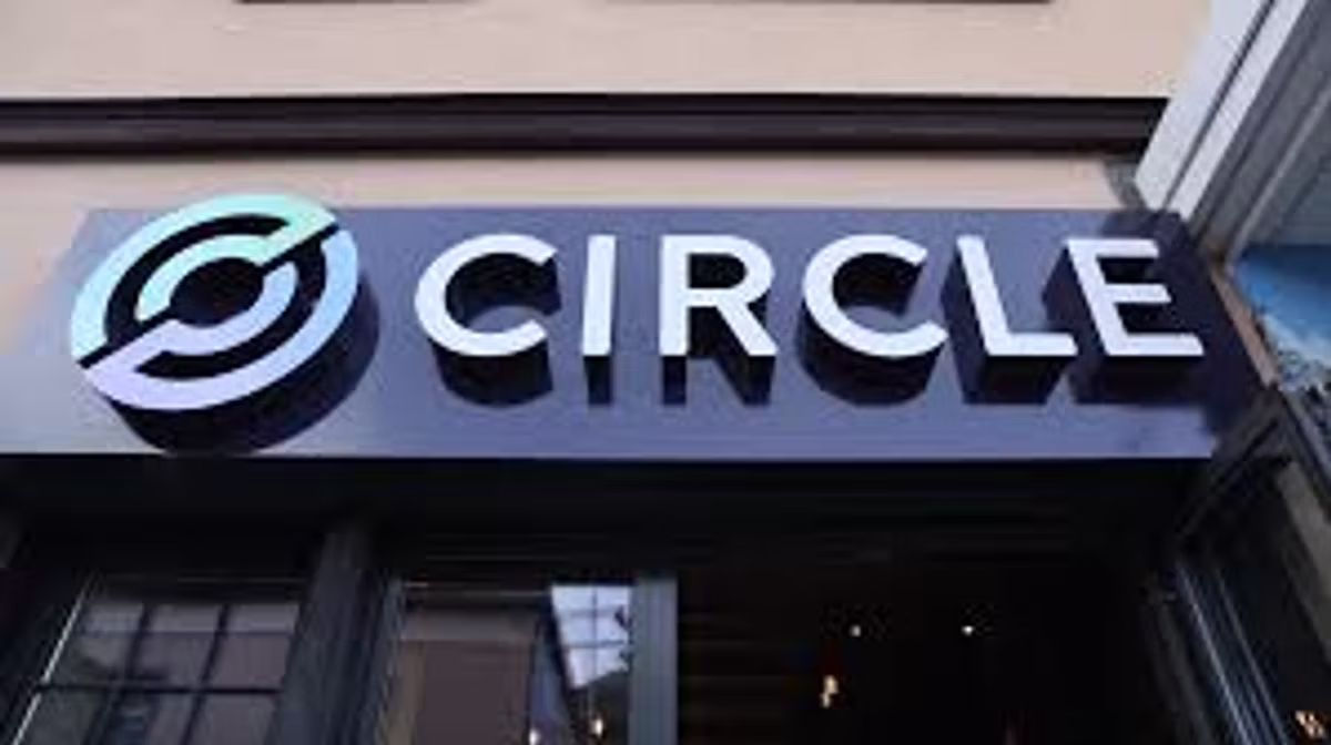 The Circle logo and wordmark on an illuminated sign above a shopfront.